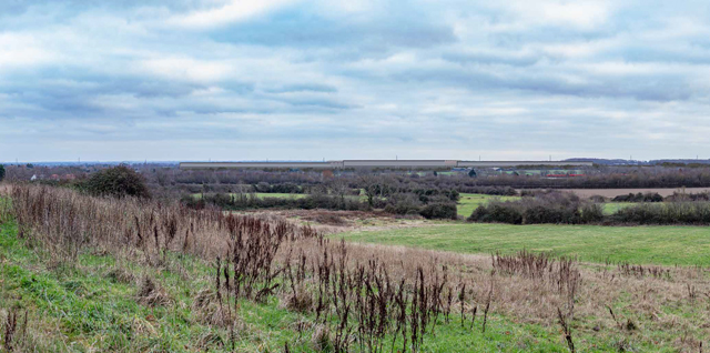 This image: an image of how the site may look 15 years from completion, as seen from the north. The map: a map of the illustrative masterplan, with green map markers which, when clicked, show images of how the site currently looks and how it may look 15 years after completion.